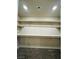 Walk-in closet with wooden shelves for ample storage at 8279 Palladium St, Las Vegas, NV 89113
