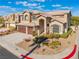 Two-story home with a landscaped yard and attached garage at 8824 Prague Ct, Las Vegas, NV 89147