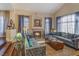 Living room with fireplace, hardwood floors, and comfortable seating at 8824 Prague Ct, Las Vegas, NV 89147