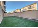 Artificial turf backyard with block wall and homes at 356 Espressivo St, Henderson, NV 89011