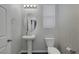 Bathroom with pedestal sink and geometric wallpaper at 356 Espressivo St, Henderson, NV 89011