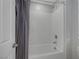 Clean bathroom with a shower/tub and gray shower curtain at 356 Espressivo St, Henderson, NV 89011