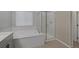 Clean bathroom with a shower, tub, and modern vanity at 356 Espressivo St, Henderson, NV 89011