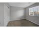 Simple bedroom with double door closet and window at 356 Espressivo St, Henderson, NV 89011