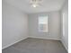 Well-lit bedroom featuring gray carpeting and a window with blinds at 356 Espressivo St, Henderson, NV 89011