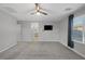 Primary bedroom with carpet, window, and access to the bathroom at 356 Espressivo St, Henderson, NV 89011