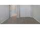 Simple bedroom with gray carpet and access to hallway at 356 Espressivo St, Henderson, NV 89011