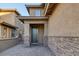 Front entrance with stone accents and a paved walkway at 356 Espressivo St, Henderson, NV 89011