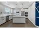 Modern kitchen with white cabinets, granite counters, and island at 356 Espressivo St, Henderson, NV 89011