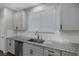 Kitchen features granite countertops and a farmhouse sink at 356 Espressivo St, Henderson, NV 89011