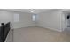 Bright and airy loft bedroom with carpet and two windows at 356 Espressivo St, Henderson, NV 89011