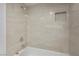 Clean bathroom with neutral tile and a shower/tub combo at 3790 Shirebrook Dr # 98, Las Vegas, NV 89115