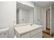 Bathroom features a vanity with storage and a large mirror at 3790 Shirebrook Dr # 98, Las Vegas, NV 89115