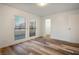 Well-lit bedroom with wood-look floors and a large closet at 3790 Shirebrook Dr # 98, Las Vegas, NV 89115