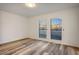 Bright bedroom with large windows and wood-look floors at 3790 Shirebrook Dr # 98, Las Vegas, NV 89115