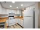 Bright kitchen features wood countertops, white appliances, and ample cabinetry at 3790 Shirebrook Dr # 98, Las Vegas, NV 89115