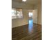 Bedroom with wood-look floors and access to another room at 9580 W Reno Ave # 114, Las Vegas, NV 89148