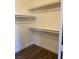 Large walk-in closet with hanging rods and shelves at 9580 W Reno Ave # 114, Las Vegas, NV 89148