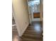 Hallway with wood-look floors and bathroom access at 9580 W Reno Ave # 114, Las Vegas, NV 89148