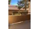 Private patio with view of trees and neighboring building at 9580 W Reno Ave # 114, Las Vegas, NV 89148