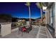 Relaxing balcony with seating offering serene views of the neighborhood, enhanced with palm trees and wrought iron railing at 2781 Josephine Dr, Henderson, NV 89044