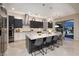 A modern kitchen features an island with barstool seating and stainless steel appliances at 2781 Josephine Dr, Henderson, NV 89044