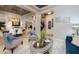 Open-concept living room with marble floors, modern furniture, and seamless transition to dining and entry areas at 2781 Josephine Dr, Henderson, NV 89044