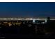 Breathtaking night view showcasing the dazzling city lights from a high vantage point with palm trees in the foreground at 2781 Josephine Dr, Henderson, NV 89044