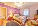 Purple bedroom with a double bed and a sitting chair at 123 Fir St, Henderson, NV 89015