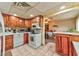 Kitchen with island, wooden cabinetry and view to dining area at 123 Fir St, Henderson, NV 89015