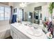 Bathroom with double vanity, large mirror, and bathtub at 2525 Kirkmichael Ln, Henderson, NV 89014