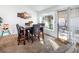 Cozy dining area with a table for six and access to a patio at 2525 Kirkmichael Ln, Henderson, NV 89014