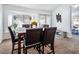 Bright dining room with bay window and seating for six at 2525 Kirkmichael Ln, Henderson, NV 89014