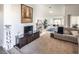 Spacious living room with fireplace, TV stand, and comfy seating at 2525 Kirkmichael Ln, Henderson, NV 89014