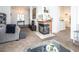 Living room with fireplace, high ceilings, and view of kitchen at 2525 Kirkmichael Ln, Henderson, NV 89014