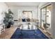 Living room with a bay window, comfy seating, and a glass coffee table at 2525 Kirkmichael Ln, Henderson, NV 89014