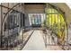 Ornate iron gate opens to a private front entry porch at 3544 Sandcliff Ln, Las Vegas, NV 89121