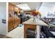 Kitchen boasts granite countertops, ample cabinetry and a breakfast bar at 3544 Sandcliff Ln, Las Vegas, NV 89121