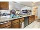 Kitchen features granite countertops, double sink, and modern appliances at 3544 Sandcliff Ln, Las Vegas, NV 89121