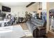 Living room with a gray couch and workspace at 3544 Sandcliff Ln, Las Vegas, NV 89121