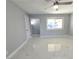 Spacious living room with ceiling fan and large window at 5808 Forrest Hills Ln, Las Vegas, NV 89108