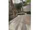 Cozy backyard featuring a charming water feature surrounded by lush landscaping and mature trees at 913 Pro Players Dr, Las Vegas, NV 89134