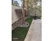 Beautifully landscaped backyard with decorative rocks, green grass, and a charming statue accent at 913 Pro Players Dr, Las Vegas, NV 89134