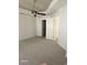 Neutral bedroom with ceiling fan, two entry doors, and light grey carpeting at 913 Pro Players Dr, Las Vegas, NV 89134