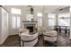 Beautiful living room with a fireplace, ample seating, and seamless connection to the dining area at 913 Pro Players Dr, Las Vegas, NV 89134