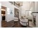 Bright, open living area with high ceilings, wood floors, and a cozy fireplace, ideal for gatherings at 913 Pro Players Dr, Las Vegas, NV 89134