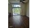 Inviting living room featuring wood floors, ceiling fan, and sliding doors to the backyard at 913 Pro Players Dr, Las Vegas, NV 89134