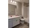 Well-lit bathroom with white vanity and tub at 10205 Starlit Canyon Ct, Las Vegas, NV 89141