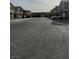 A long street view shows a row of modern townhouses in a residential neighborhood at 10205 Starlit Canyon Ct, Las Vegas, NV 89141