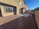 Private backyard with gravel landscaping and a fire pit at 117 Logan Pond Way, North Las Vegas, NV 89084